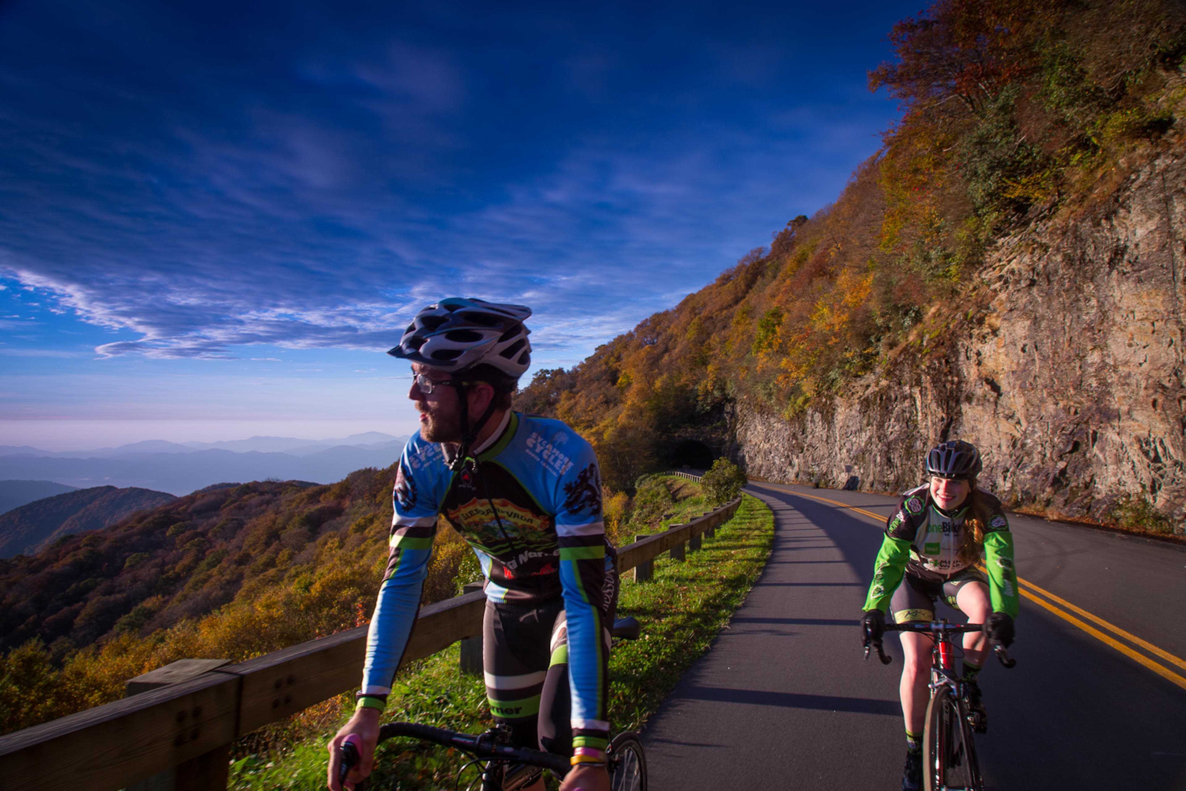 Two cyclists ride the Blue Ridge Parkway in Asheville Two cyclists ride the Blue Ridge Parkway in Asheville