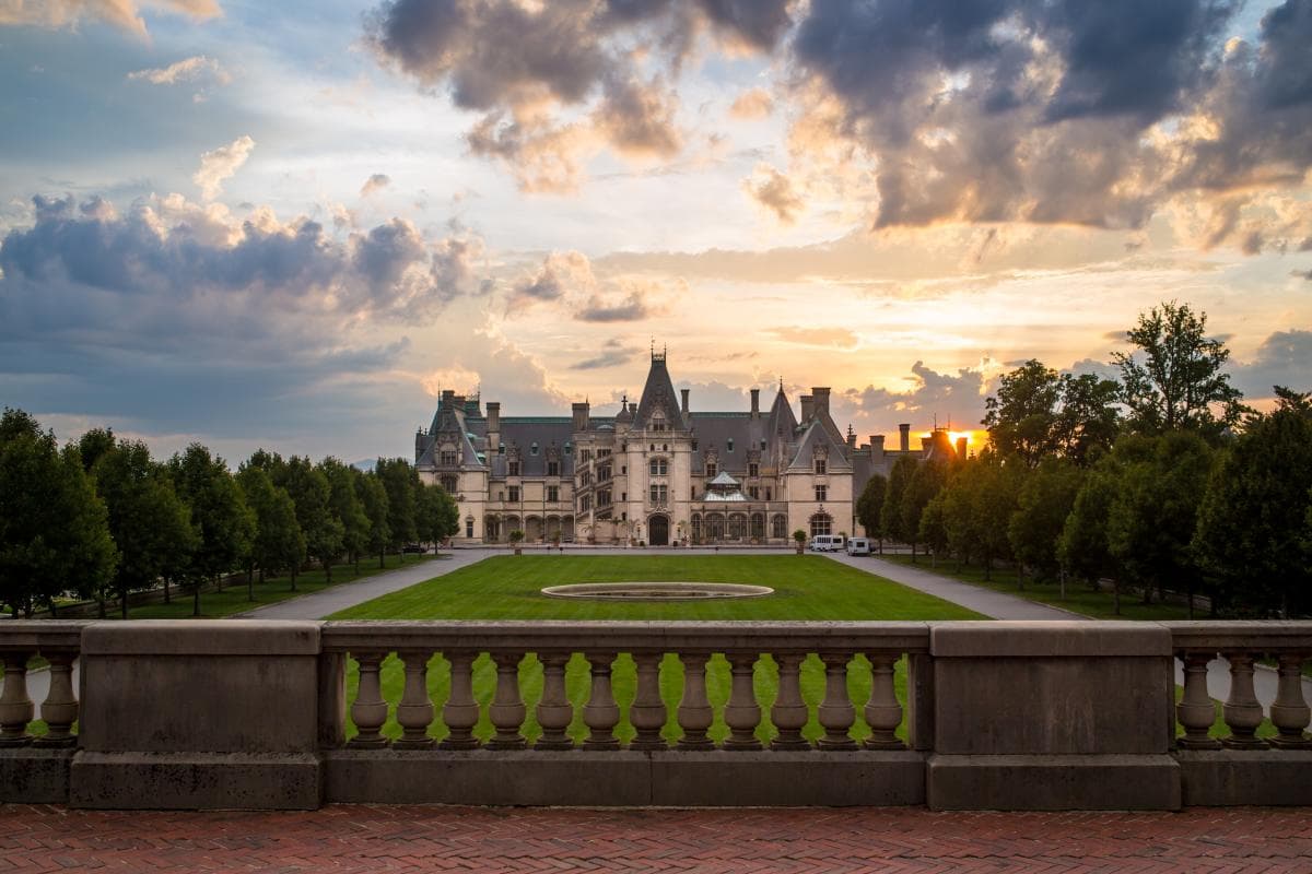 The sun sets behind the beautiful Biltmore in Asheville. The sun sets behind the beautiful Biltmore in Asheville.