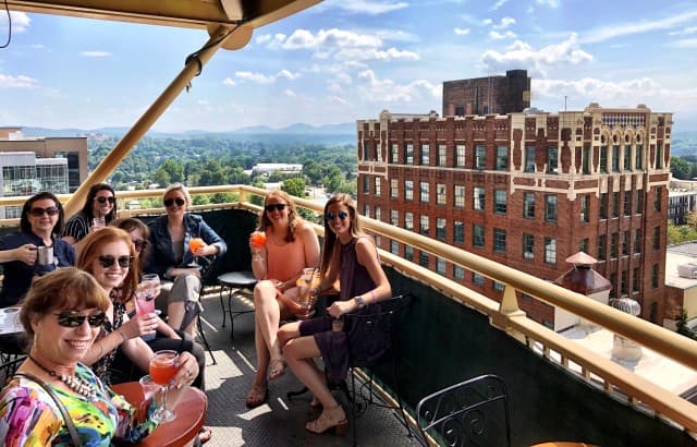Award winning rooftop bars and the history of the city of Asheville, NC all from the rooftops. Recent tour photo. Award winning rooftop bars and the history of the city of Asheville, NC all from the rooftops. Recent tour photo.